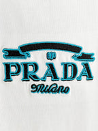 Prada Milano logo embroidery on white T-shirt, blue and black thread