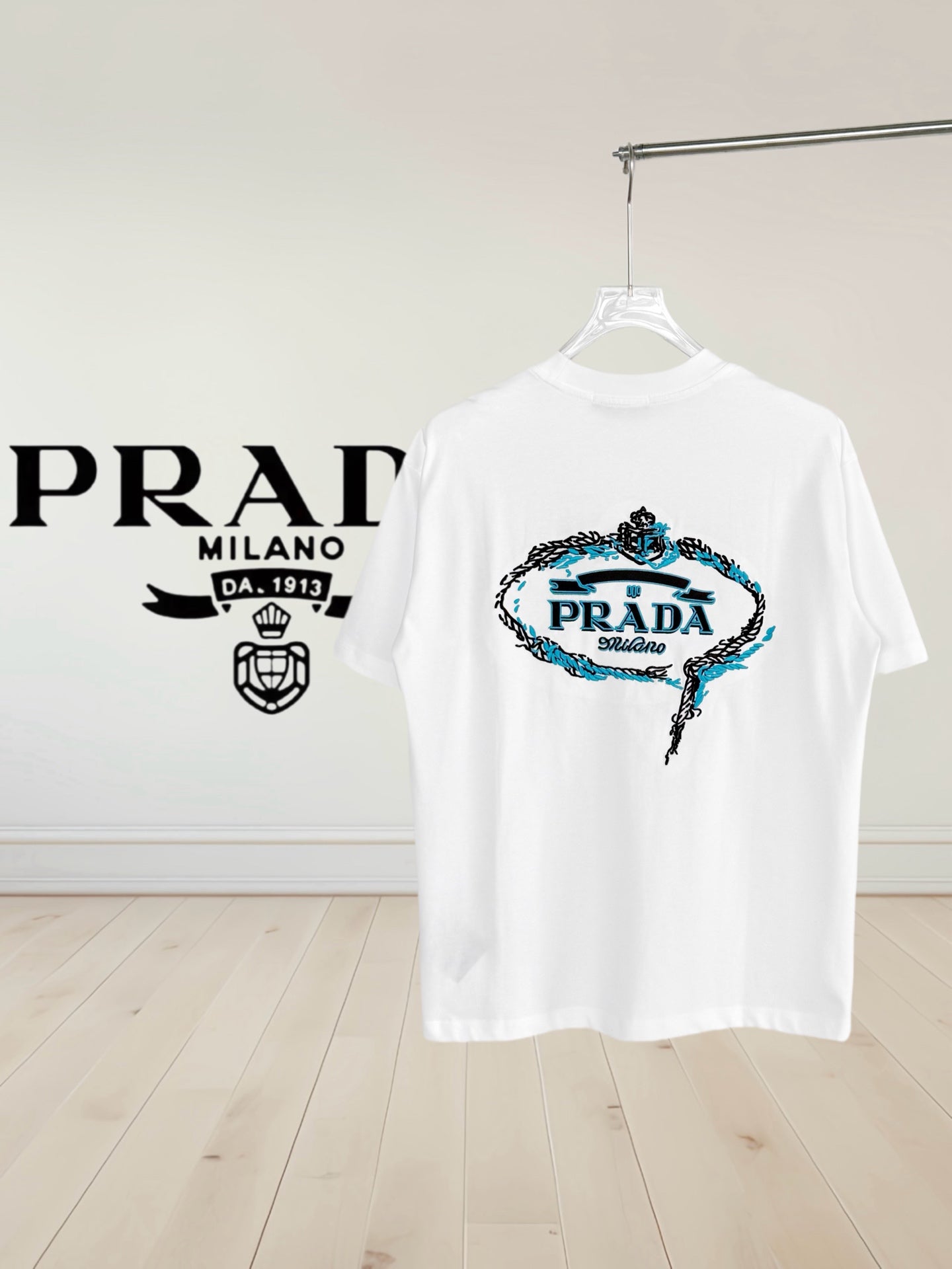 Prada short-sleeve T-shirt, white, large embroidered crest graphic on chest