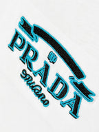 Prada Milano embroidery detail on white T-shirt with blue accents