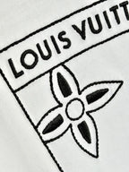 White knit fabric with embroidered Louis Vuitton logo and flower emblem