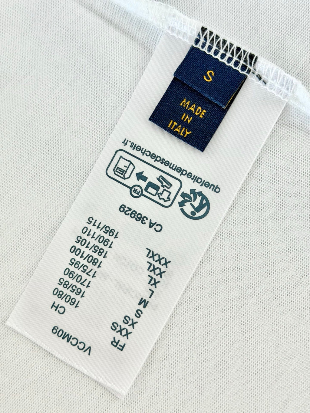 Inside T-shirt care label with Made in Italy and size markings