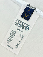 Inside T-shirt care label with Made in Italy and size markings