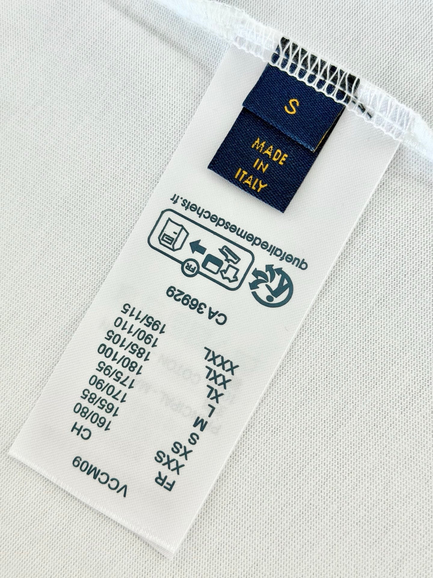 Inside T-shirt care label with Made in Italy and size markings