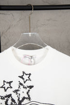 White short-sleeve T-shirt neckline with black starburst graphic detail