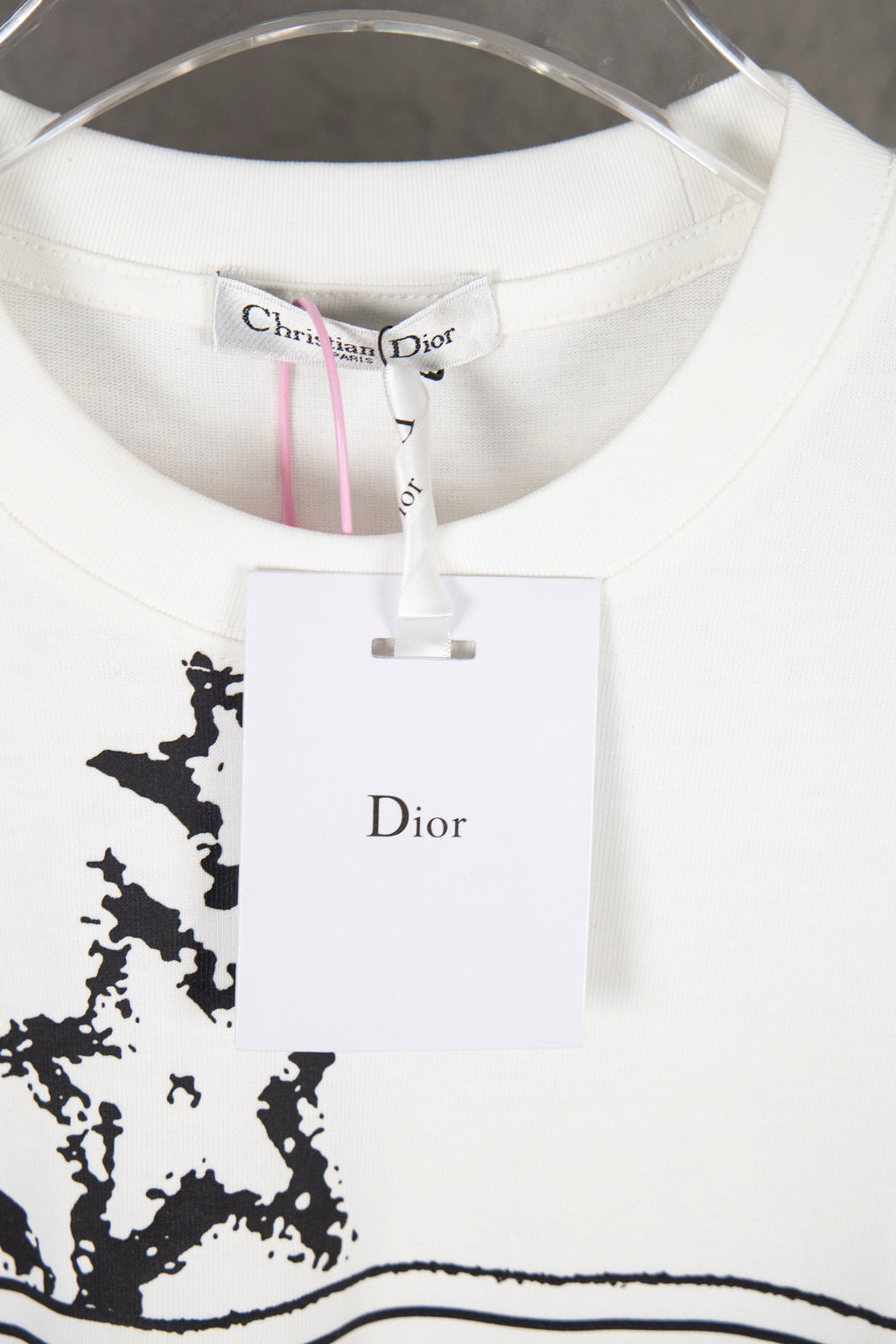 White Dior T-shirt collar and front Dior label graphic with black starburst print