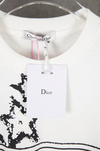 White Dior T-shirt collar and front Dior label graphic with black starburst print