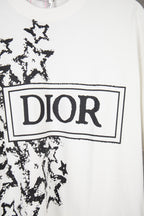 White short-sleeve T-shirt close-up of Dior logo box with black starburst graphic