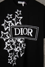 Black short-sleeve T-shirt with large white DIOR logo and starburst pattern