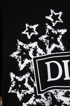 Black short-sleeve T-shirt with white starburst print and DIOR logo edge detail
