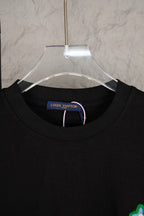 Black crewneck T-shirt with Louis Vuitton neck label and ribbed collar
