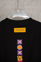 Black short-sleeve T-shirt with neck label and stacked multicolor icons on back