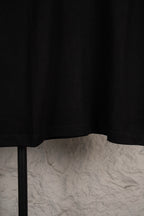 Black short-sleeve T-shirt with straight hem and relaxed drape