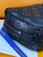 Louis Vuitton monogram belt bag style with front zipper and rectangular leather tab