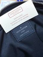 Louis Vuitton small men bag label and stitched logo patch near zipper