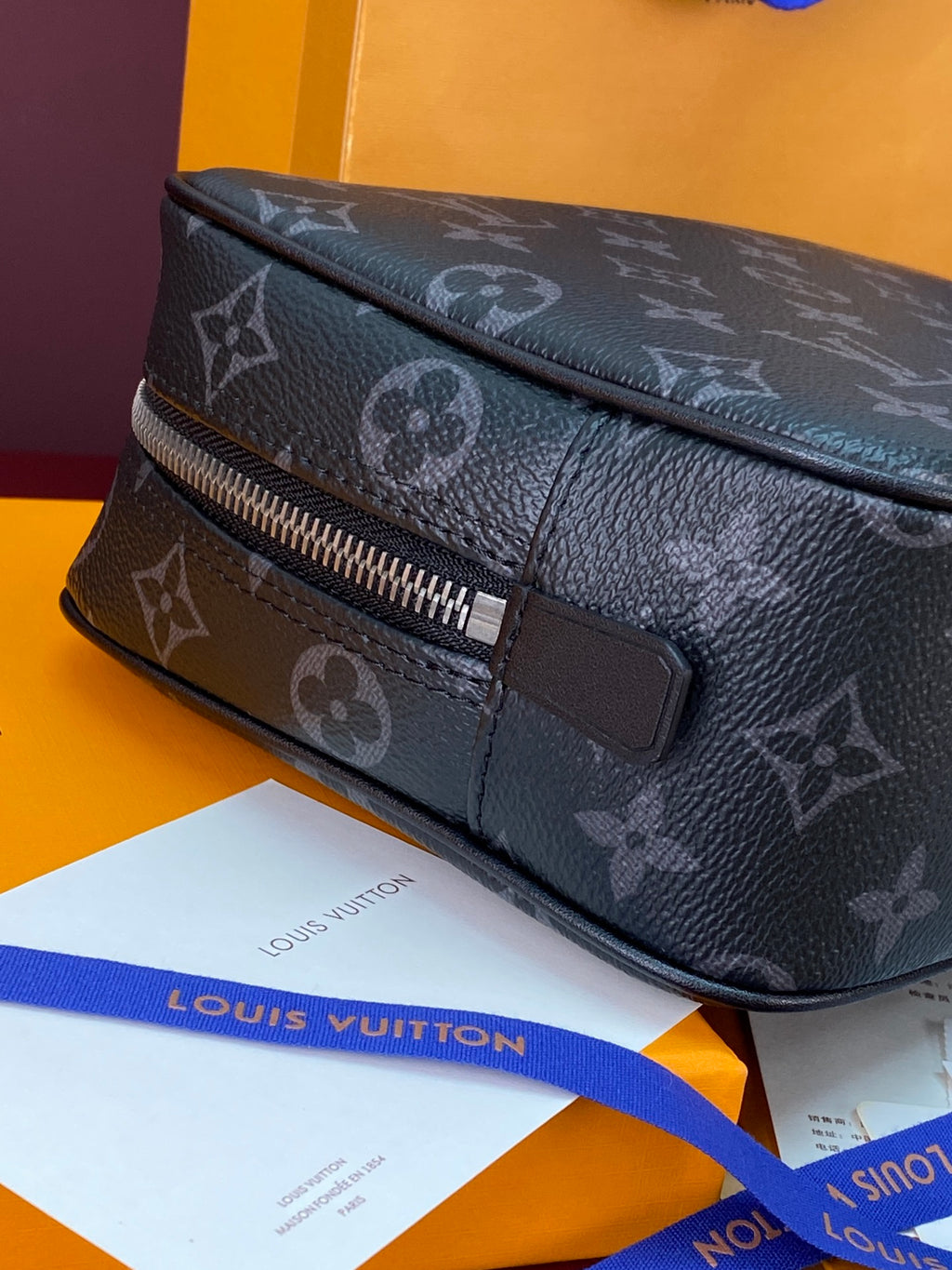 Louis Vuitton monogram small men bag back view with leather strap detail