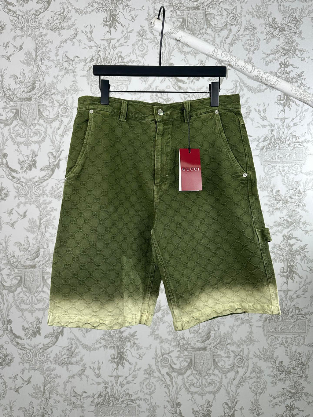 Green Gucci patterned shorts with front pockets and belt loops.