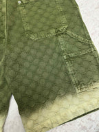 Green Gucci shorts front with cargo pocket and scalloped hemline detail.