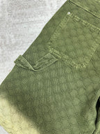 Green Gucci shorts with side flap cargo pocket and stitched panels.