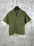 Gucci green short-sleeve button-up shirt with allover monogram pattern and pockets