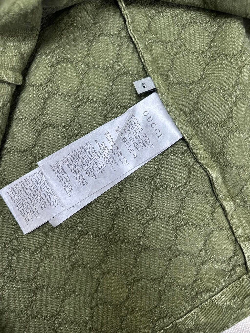Gucci green short-sleeve shirt with care/size label on inner seam