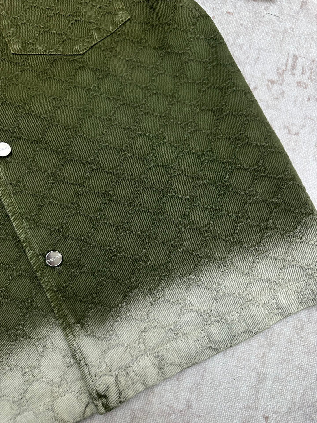 Gucci green shorts side view with pocket and allover monogram pattern