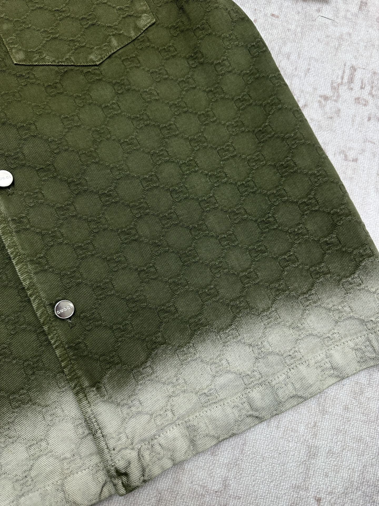 Gucci green shorts side view with pocket and allover monogram pattern