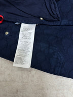 Blue monogram shorts with white care label and gathered waist detail