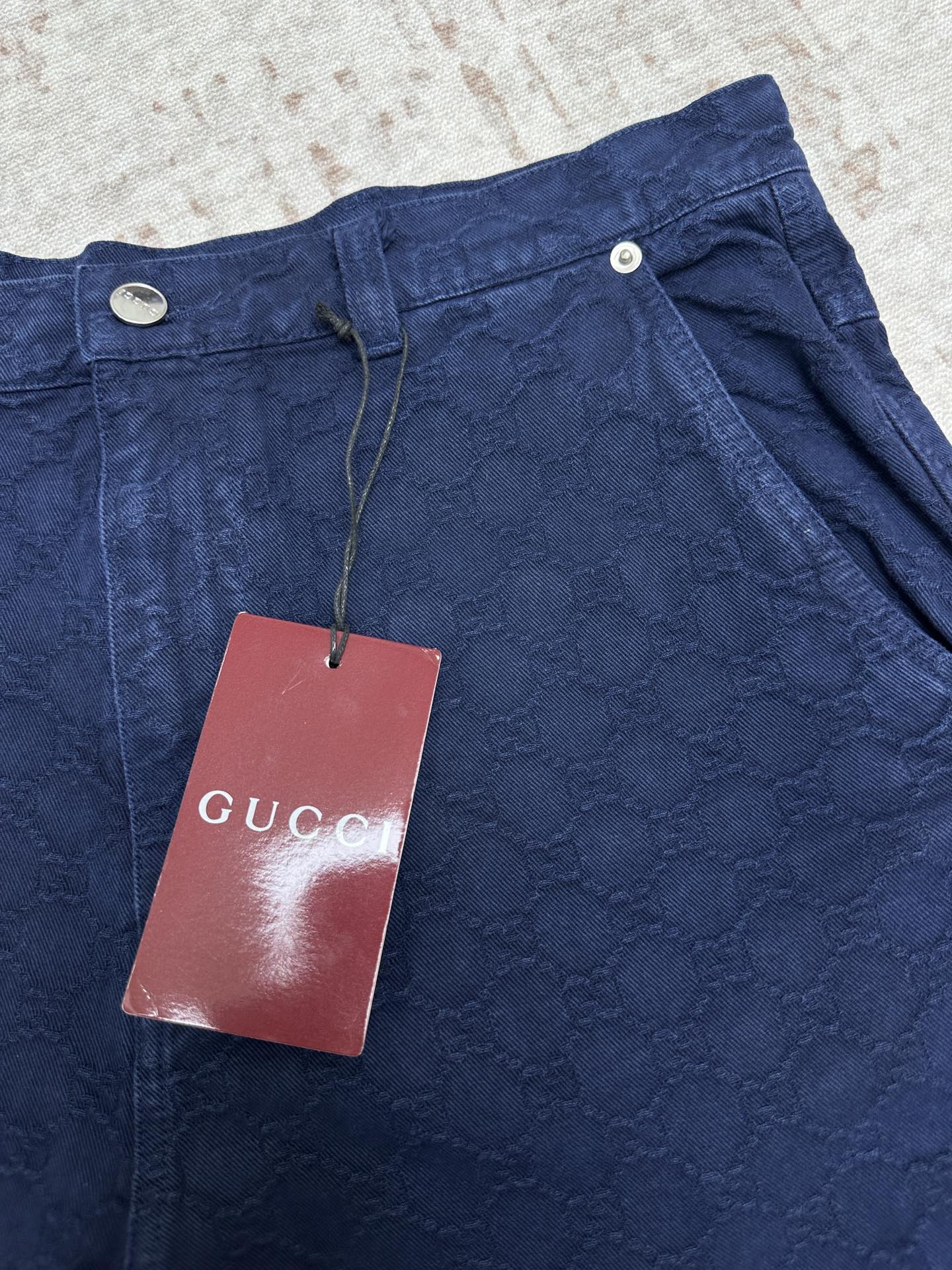 Blue monogram shorts with Gucci tag and drawstring waist
