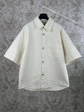 White short-sleeve button-up shirt with point collar and chest pocket