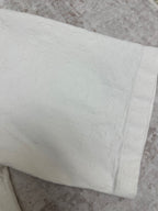 White short-sleeve shirt with folded sleeve cuff detail