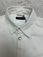 White button-up shirt collar with top button and Louis Vuitton neck tag