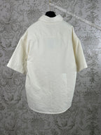 White short-sleeve button-up shirt with crew-neck back yoke