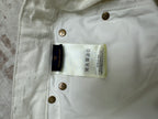 White shorts care label and size tag inside waistband