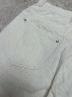 White shorts back pocket with metal rivet accents