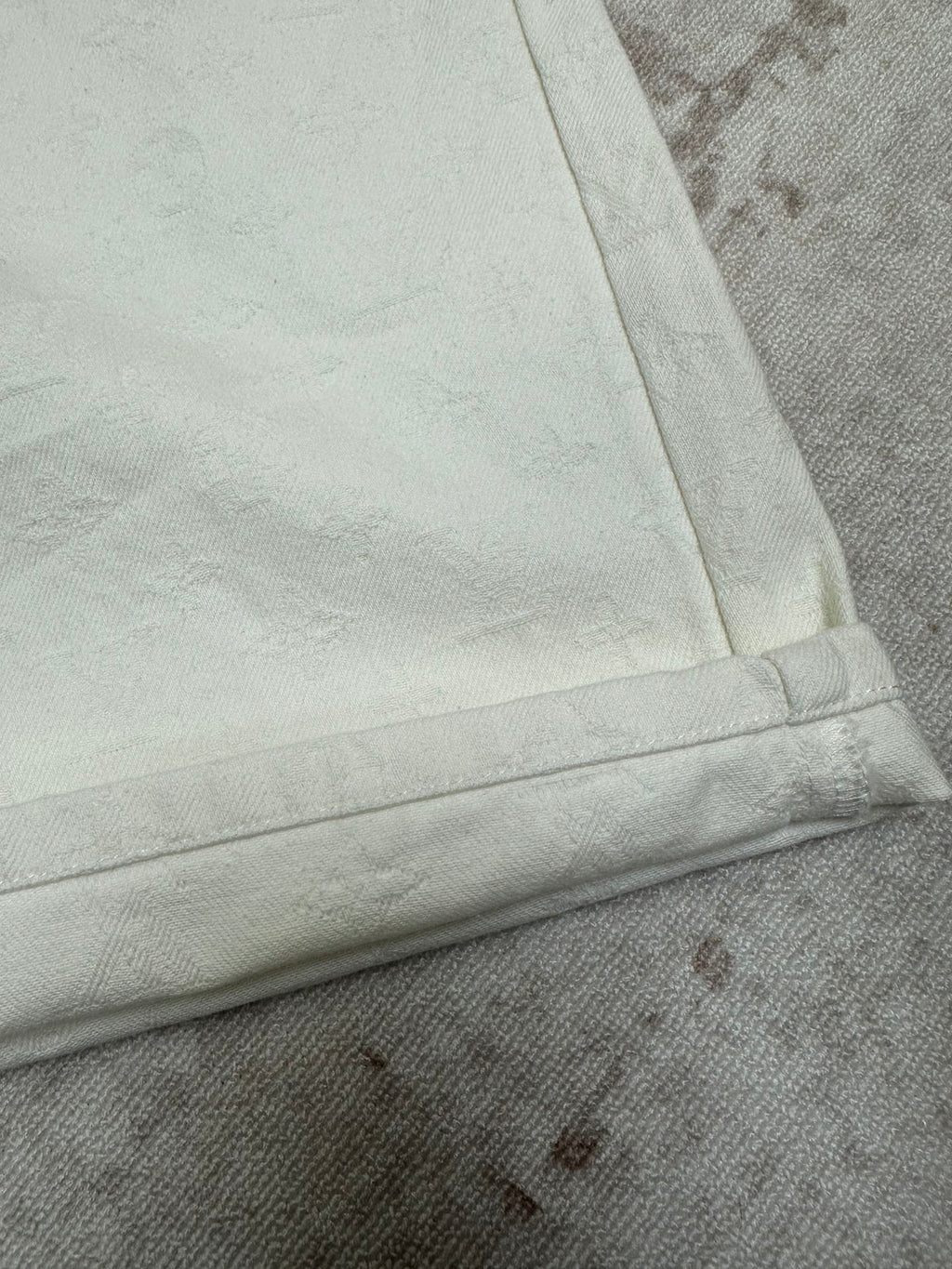 White shorts cuff and side seam with bartack stitching