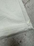 White shorts cuff and side seam with bartack stitching