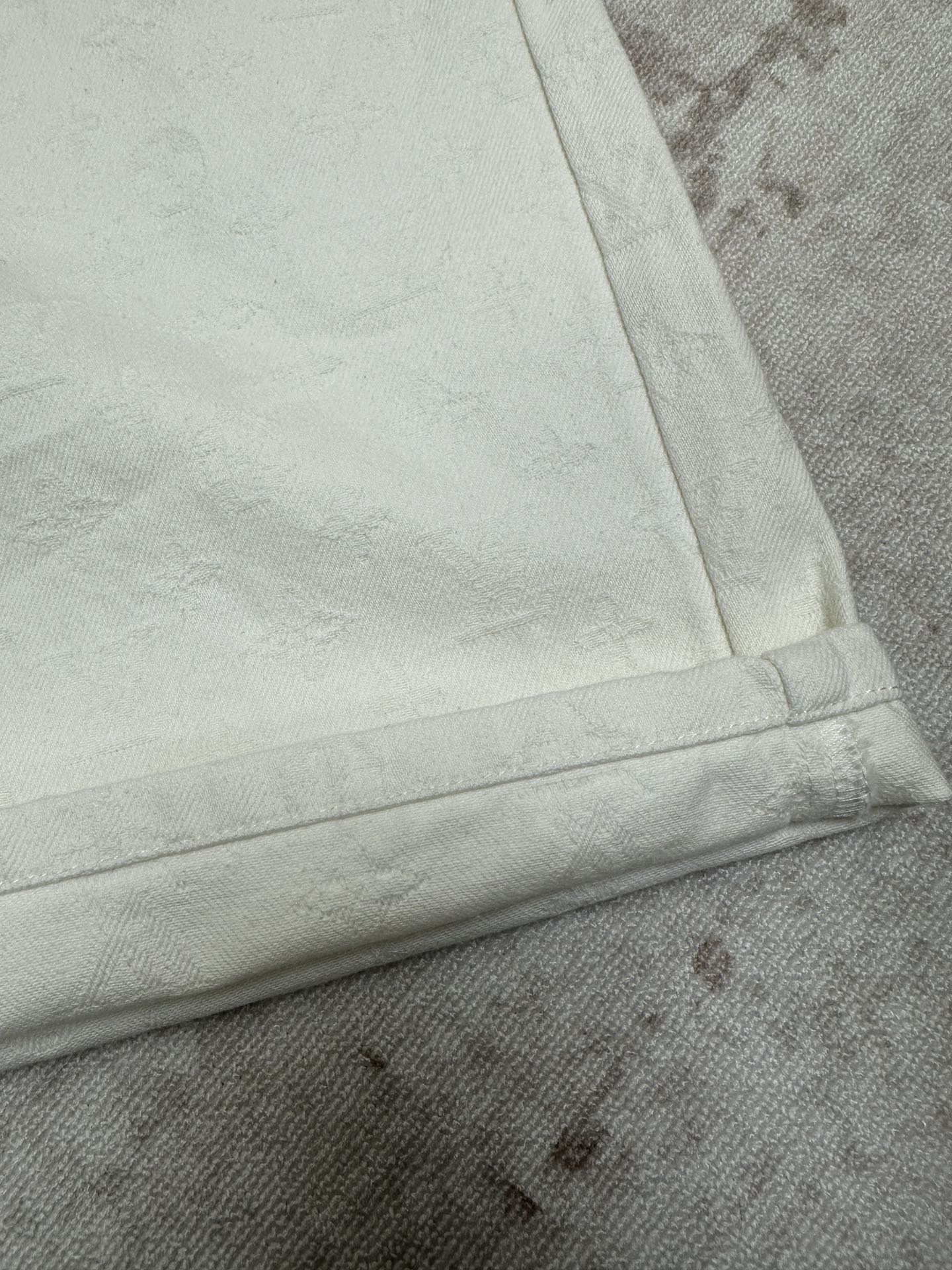 White shorts cuff and side seam with bartack stitching