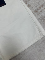 White denim shorts hem with stitched side seam