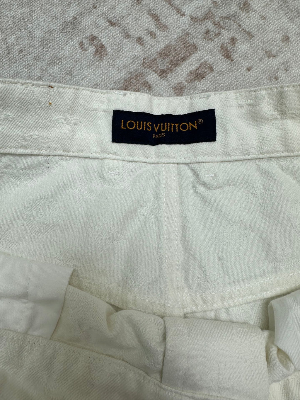 White shorts inner waistband with Louis Vuitton fabric label