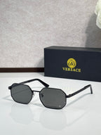 Versace sunglasses with black hexagonal frames and dark gray lenses.
