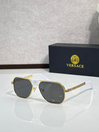 Versace sunglasses with gold frame and dark lenses, square shape with white arms