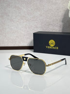 Versace sunglasses with gold frame and dark gray lenses, square aviator style