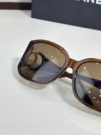 Chanel glasses side profile with tortoiseshell frame and tinted amber lenses