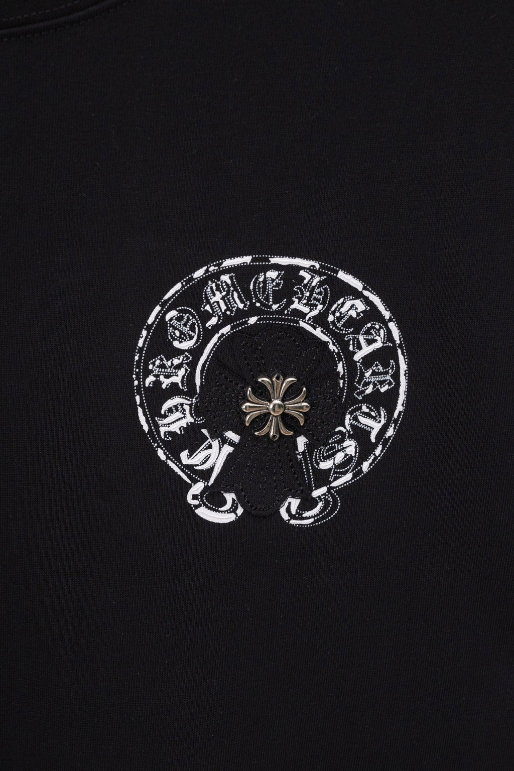 Black chrome short T-shirt with small circular emblem graphic