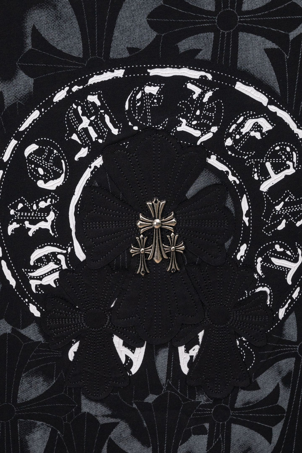Black chrome short T-shirt close-up of ornate circular emblem center design
