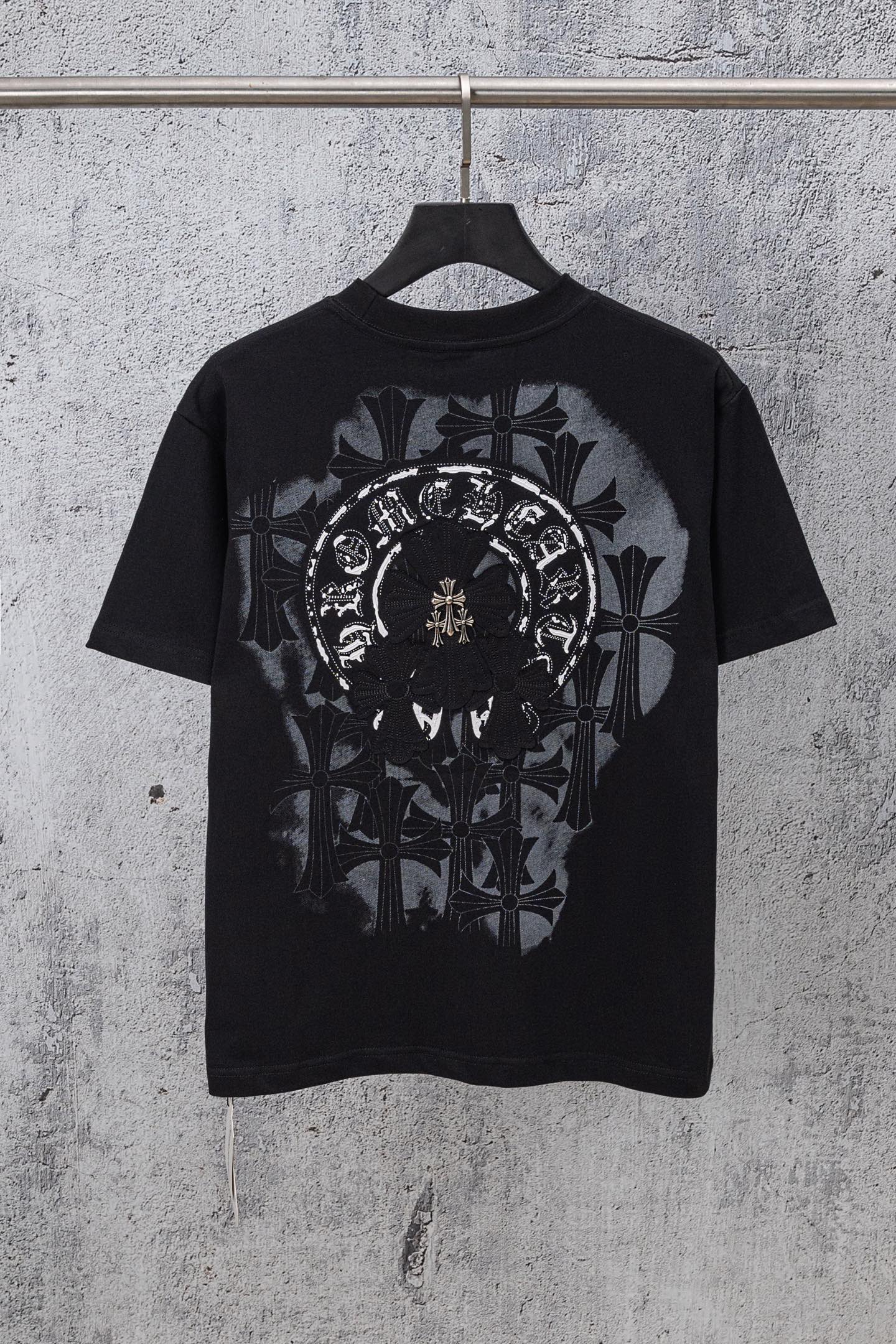 Black chrome short T-shirt with large circular front graphic and ornamental leaves