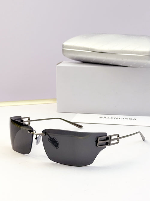 Rectangular dark sunglasses with metallic gold hinges and tinted lenses