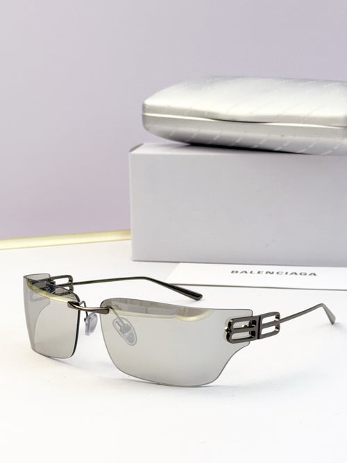 Square-edge sunglasses with clear dark lenses and metallic gold bridge detail
