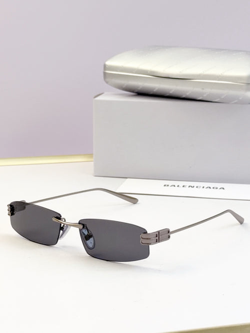Balenciaga sunglasses, dark gray lenses and slim gold-tone metal frame