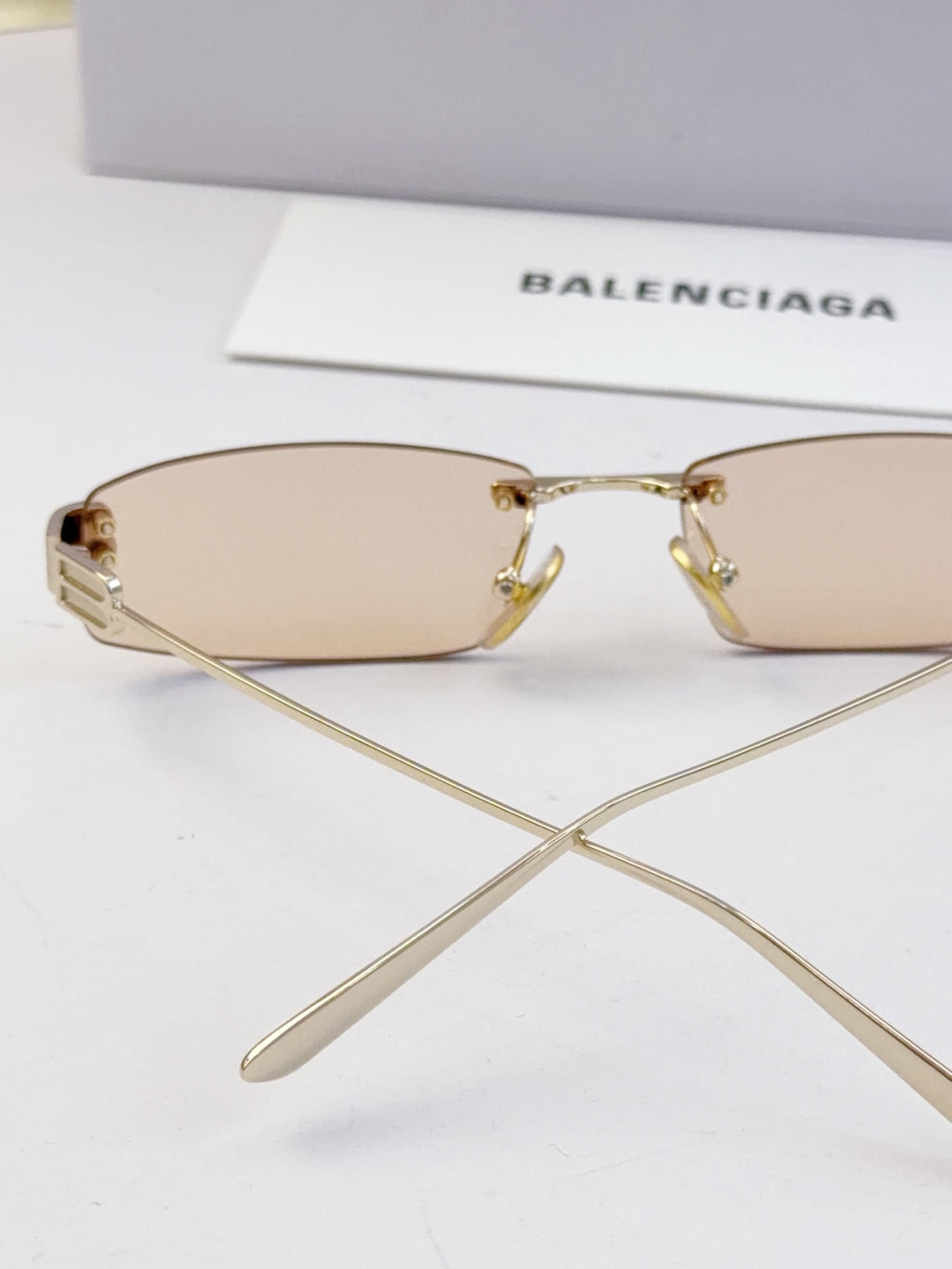 Balenciaga sunglasses, light tan lenses and gold-tone metal bridge